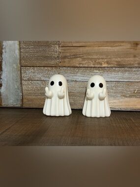 Pair of White Ghost Figurines Giving the Middle Fingers